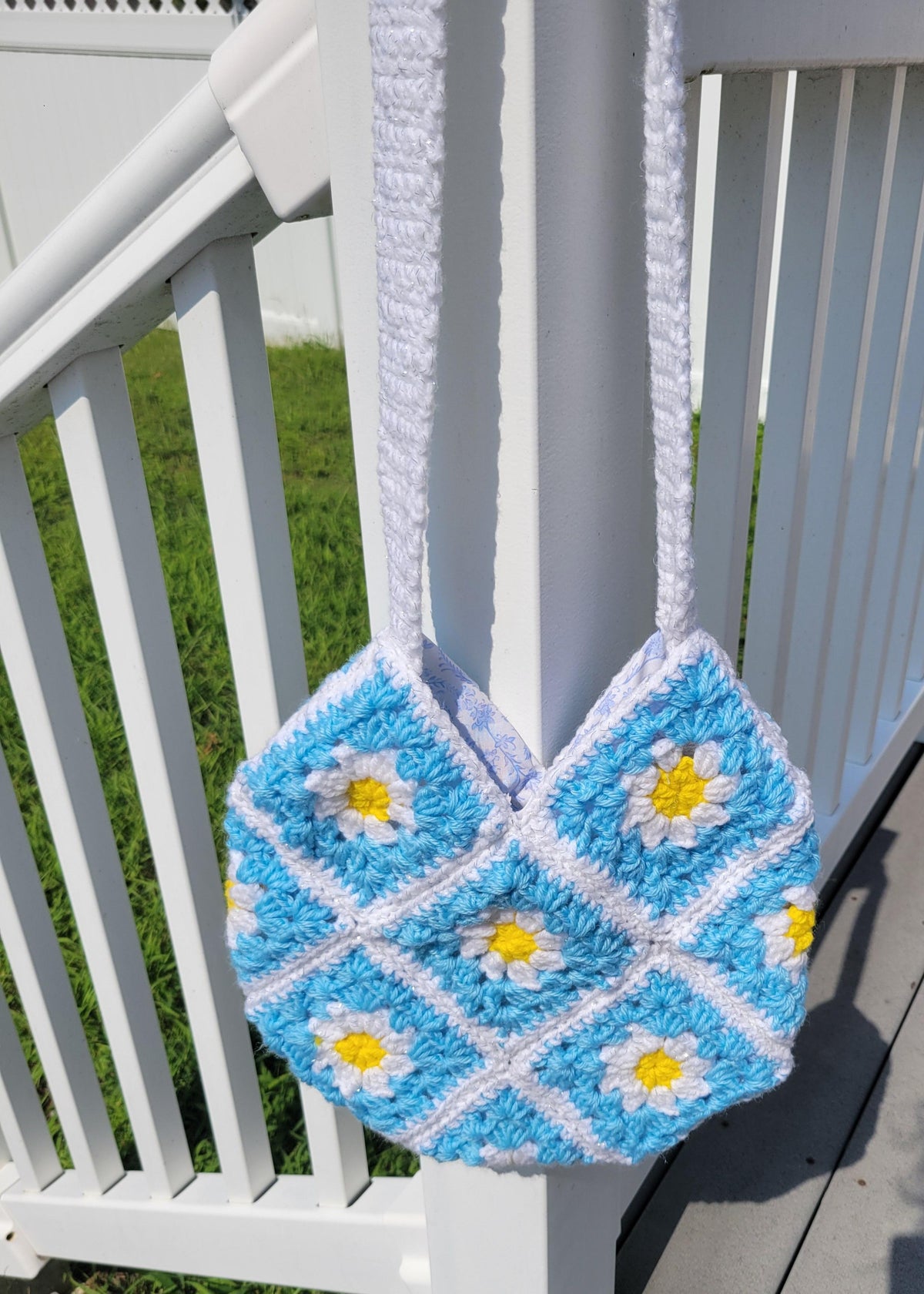 Crocheted granny tote bag. White, blue, and yellow flowers. Fully lined with zipper