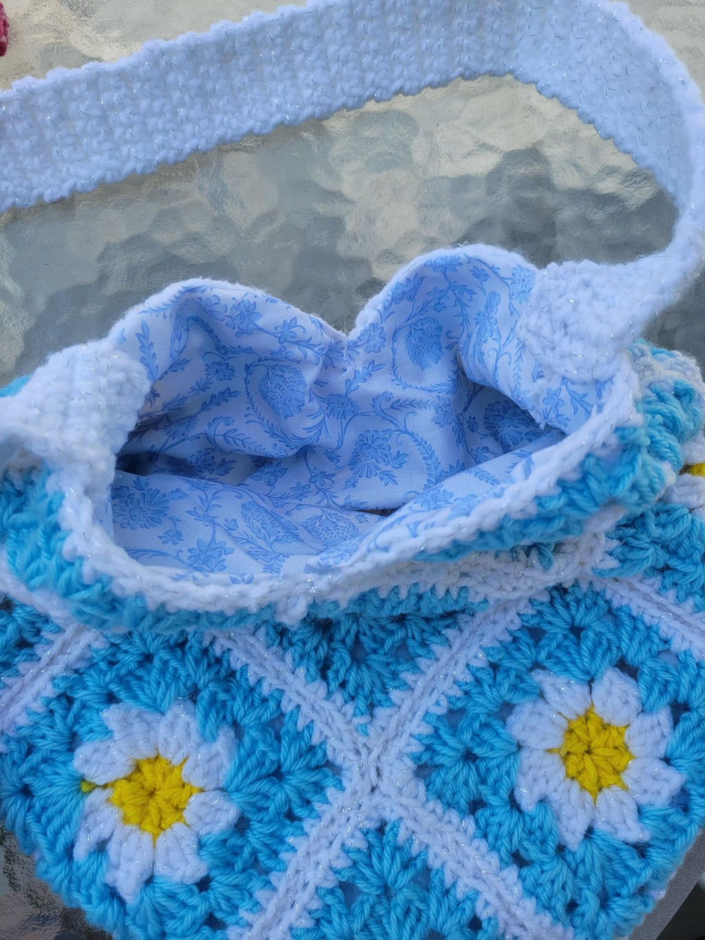 Crocheted granny tote bag. White, blue, and yellow flowers. Fully lined with zipper
