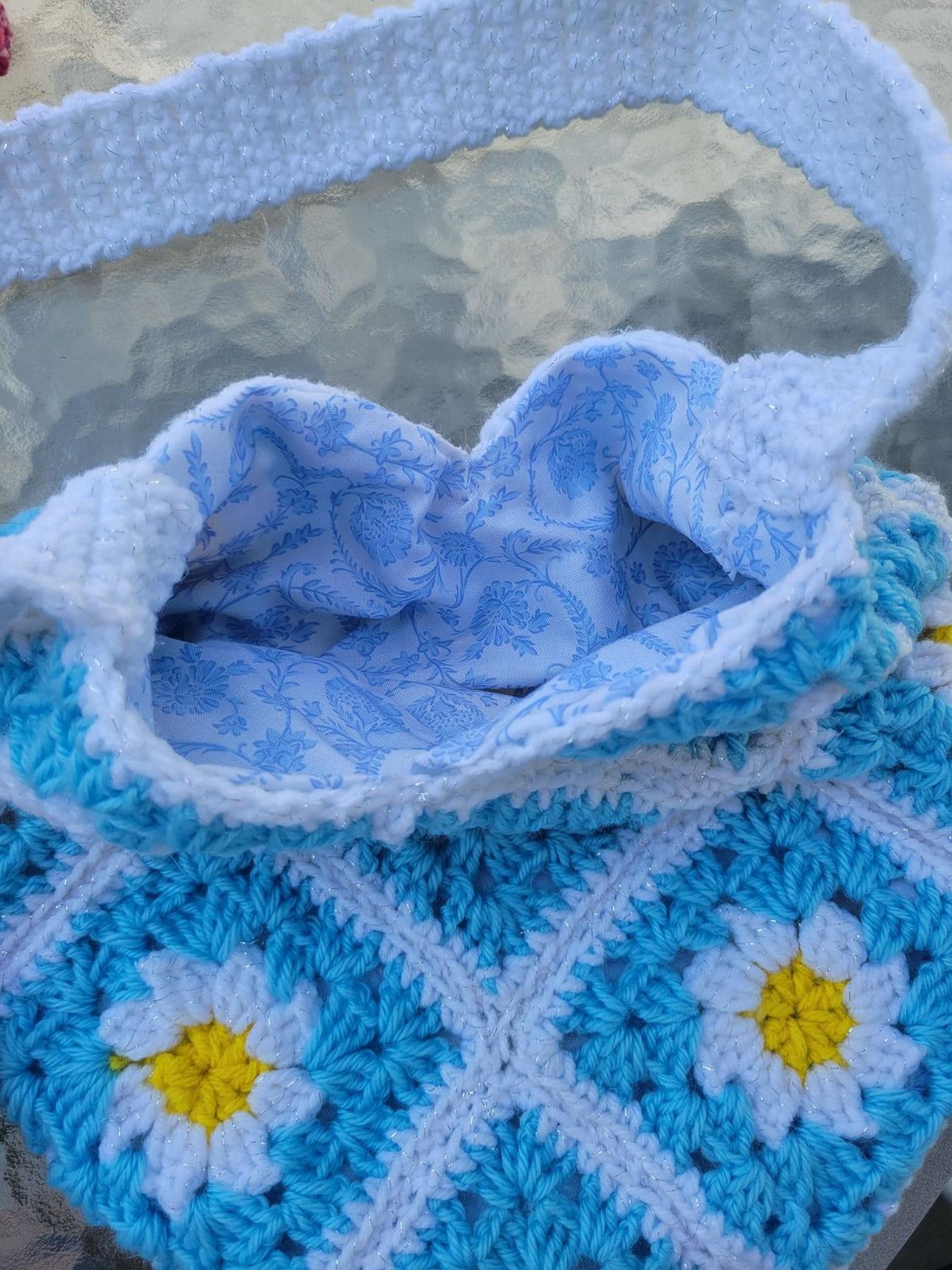 Crocheted granny tote bag. White, blue, and yellow flowers. Fully lined with zipper