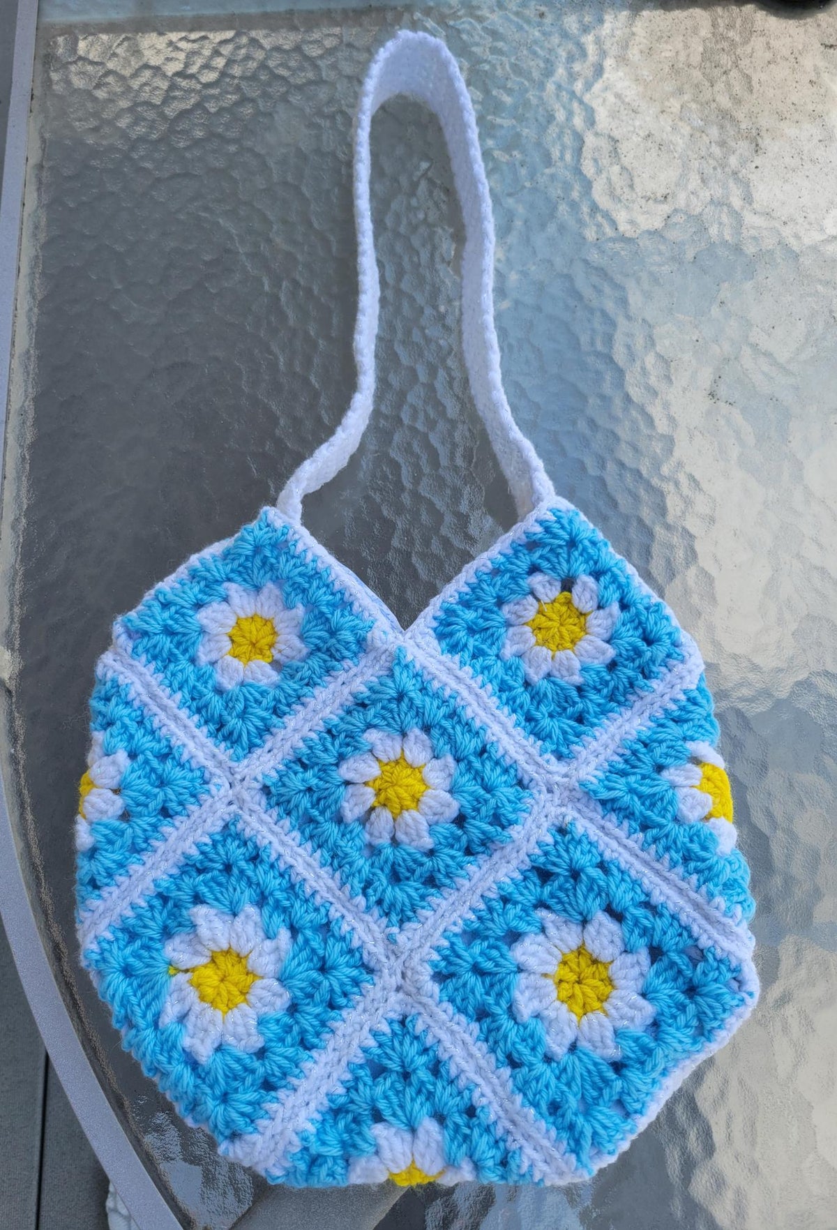 Crocheted granny tote bag. White, blue, and yellow flowers. Fully lined with zipper